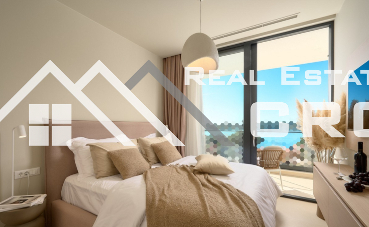 Luxurious villa with a pool and garage, situated in a peaceful setting with an open sea view, for  sale