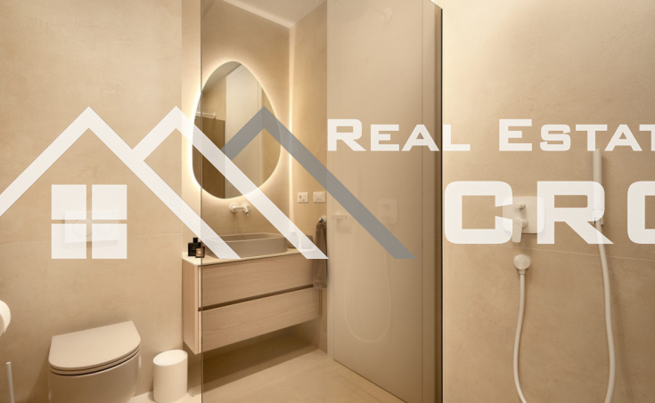 Luxurious villa with a pool and garage, situated in a peaceful setting with an open sea view, for sale (15)