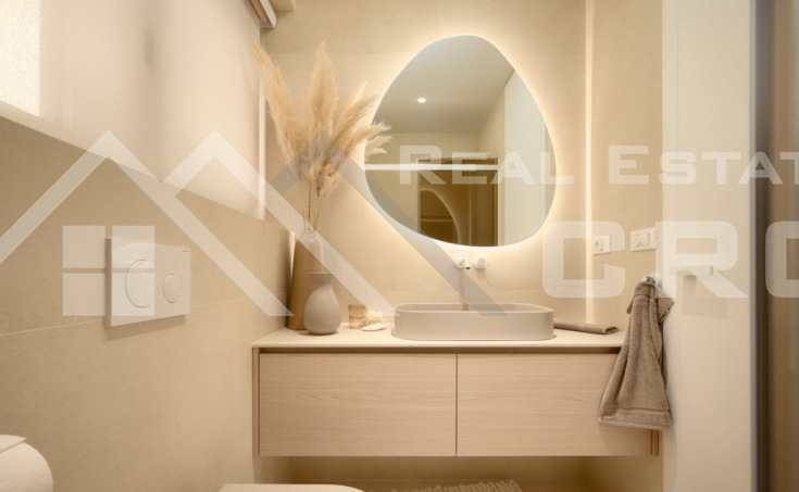 Luxurious villa with a pool and garage, situated in a peaceful setting with an open sea view, for sale (17)