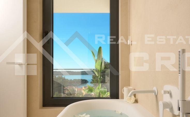 Luxurious villa with a pool and garage, situated in a peaceful setting with an open sea view, for sale (18)