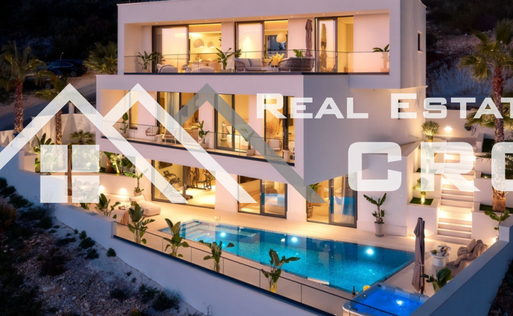 Luxurious villa with a pool and garage, situated in a peaceful setting with an open sea view, for sale (8)