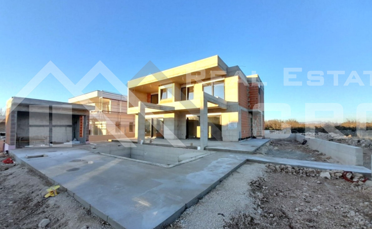 Modern villa with a swimming pool, situated in a peaceful settlement, for sale