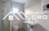 Modern apartment with a garden, near a lovely beach, surroundings of Sibenik, for sale