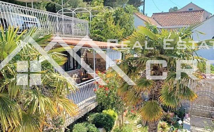Brac properties - House with a beautiful garden, an auxiliary building and a parking lot, second row to the sea, for sale